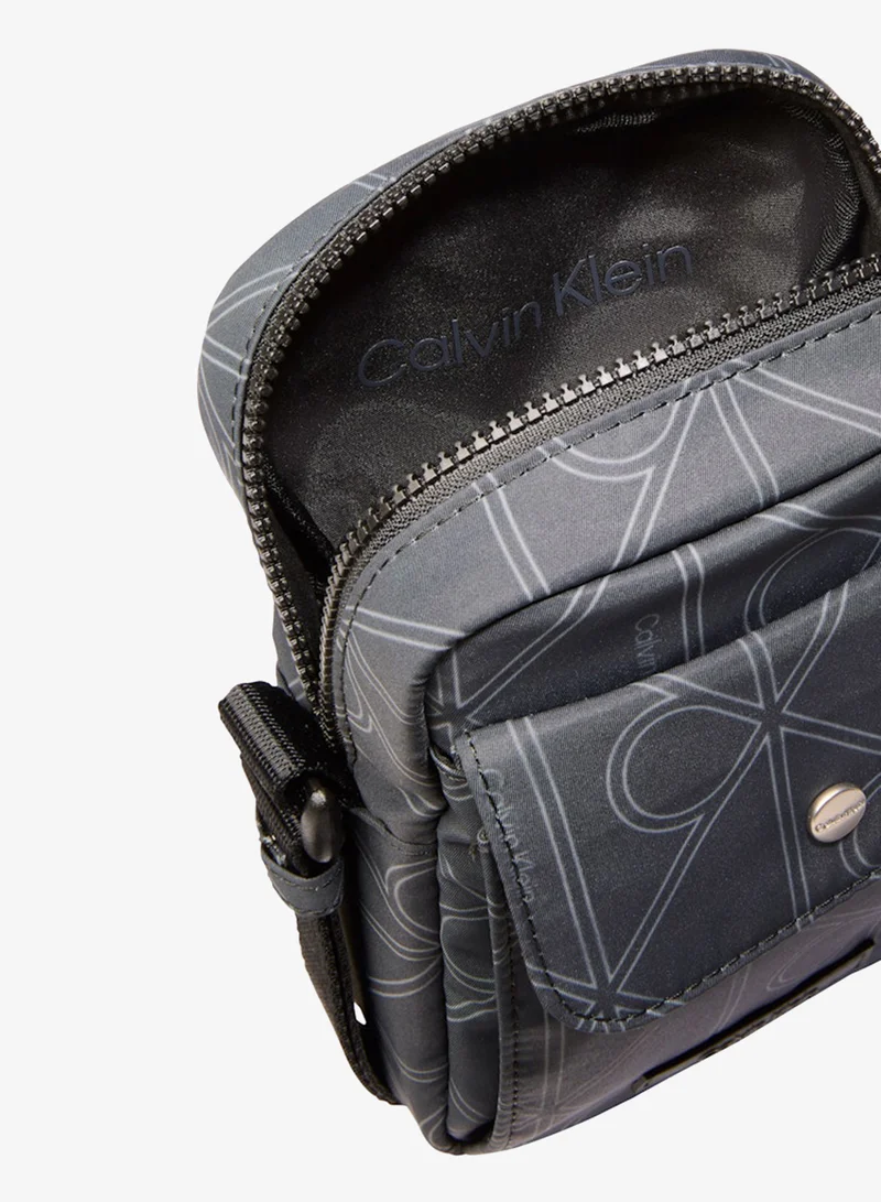 Calvin Klein  all over print messenger bag for Men | Best Price UAE